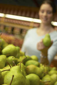Woman selecting pear